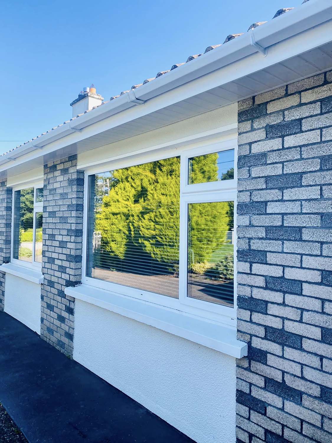 Gutter and window cleaning on a bungalow